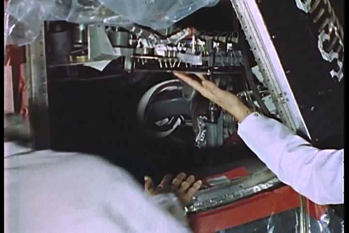 1960s - Astronaut John Glenn boards the Mercury spacecraft.