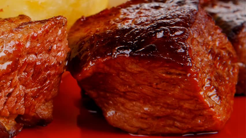 european food: roast beef meat goulash over red plate with tomatoes and dill and bbq sauce 1920x1080 intro motion slow hidef hd