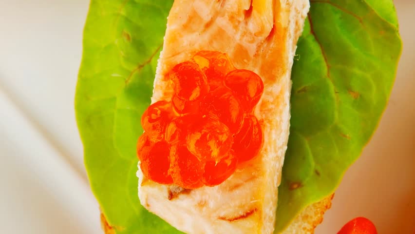 small salmon sandwiches served with caviar and olives 1920x1080 intro motion slow hidef hd