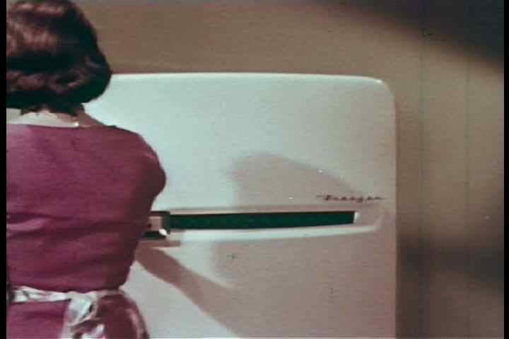 1950s - We see how plastic wrap is used to protect food which is soon to be served as well as that which will be stored in the refrigerator.
