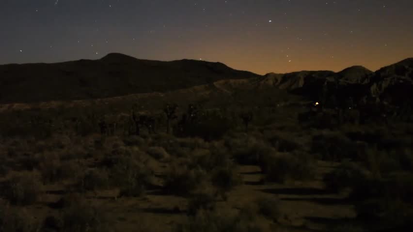 Astrophotography Time Lapse Moonshadow across Desert Horizon Tilt Up