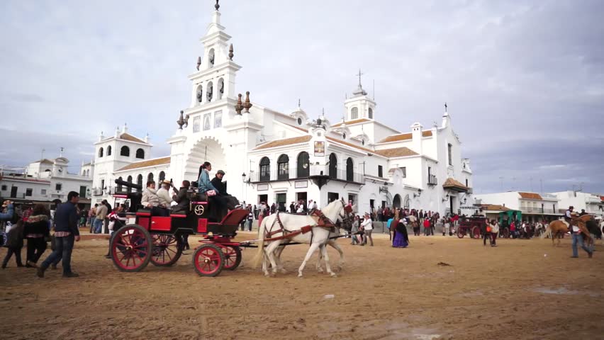 El ROCIO, ANDALUCIA, SPAIN - MAY 19: Pilgrims, people attend to the Sanctuario de Nuestra Senora de El Rocio in one of the most famous religious pilgrimage of Spain. May 19, 2013 in el Rocio, Spain