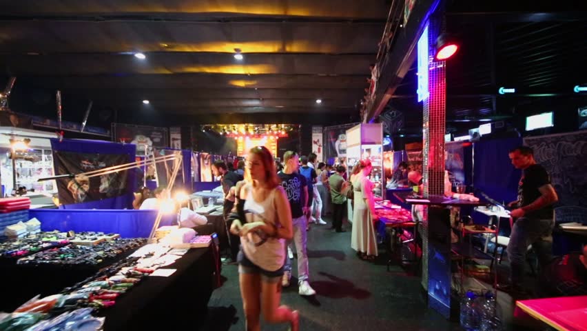 MOSCOW - MAY 20: People walk by market in club ARENA during Moscow International Tattoo Convention V on May 20, 2012, Moscow, Russia. 150 artists from around world came to work on event