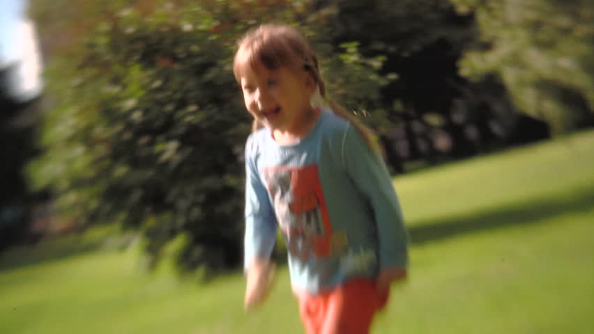 Sequence of soft focus shots. Father with little girl playing in the park