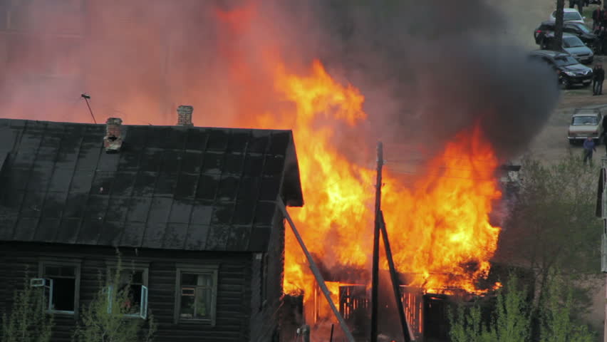 Wooden residential house in fire. Russia