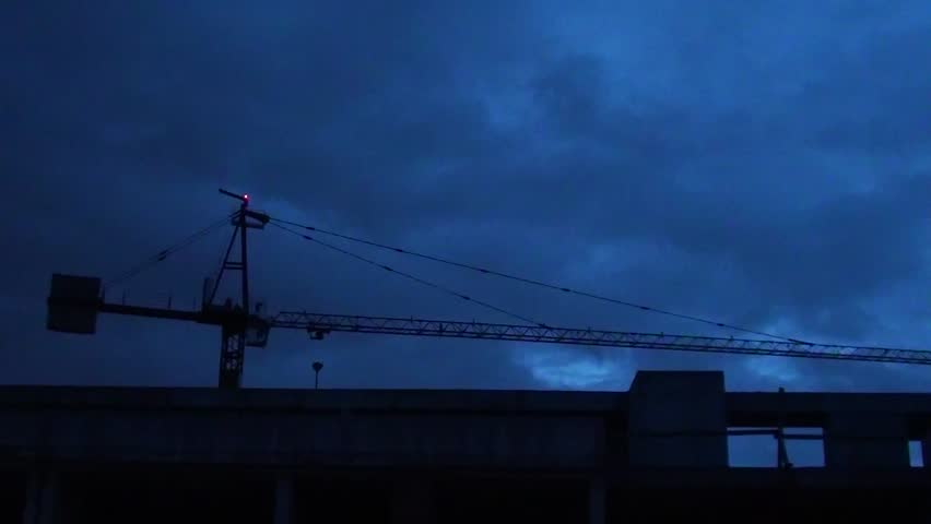 Construction site and crane at night 