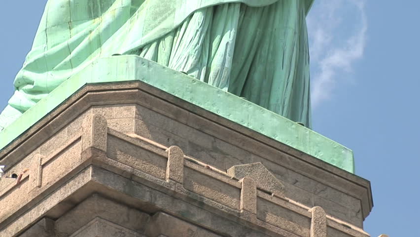 New York - MAY 16 2009: Tourists are starting to return to popular vacation spots like the Statue of Liberty after the world wide recession starts showing signs of recovery. 