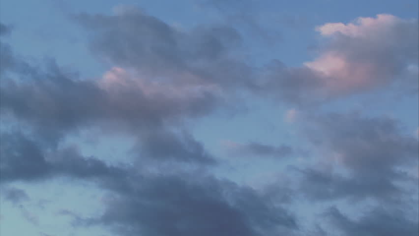 Flowing and morphing clouds during sunset. Time lapse.