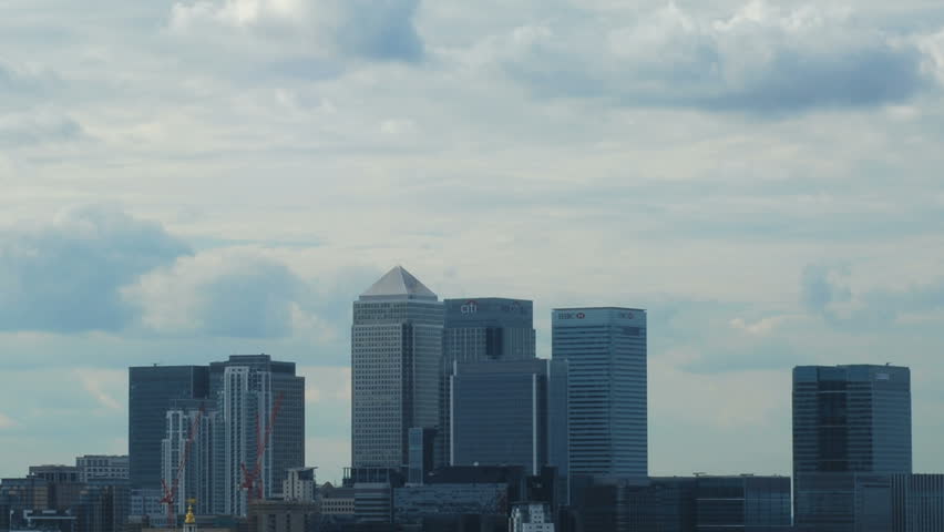 Time lapse of a cloudy sky passing behind the skyscrapers of Canary Wharf in the city of London, UK