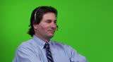 Young business man on headset - close-up - green screen version