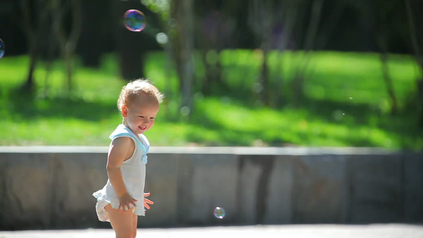 The girl and soap bubbles