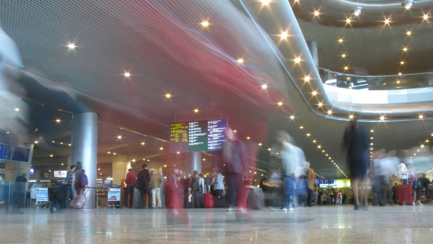 MOCSOW - JUNE 16: Passengers with luggage in airport Domodedovo June 16, 2009 in Moscow, Russia. Time lapse. Domodedovo is RussiaÃ¢â¬â¢s largest airport in terms of passenger and cargo traffic. 