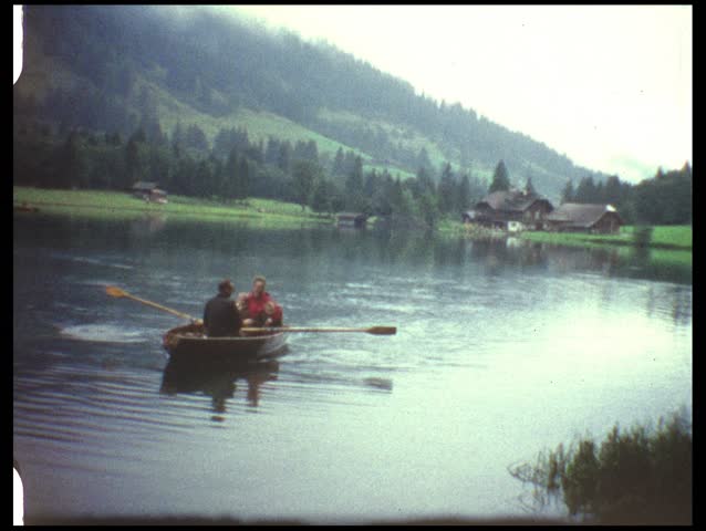 Rowing on mountain lake (vintage 8 mm film from the 1960s)