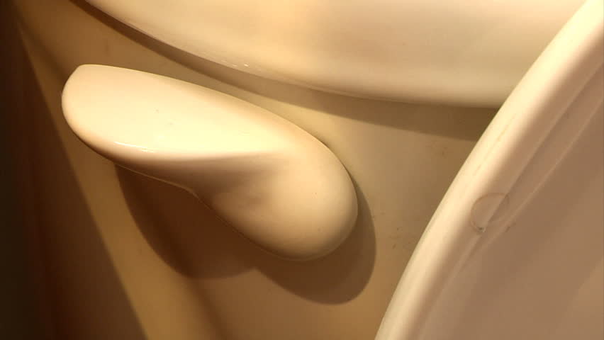 Flushing a toilet.