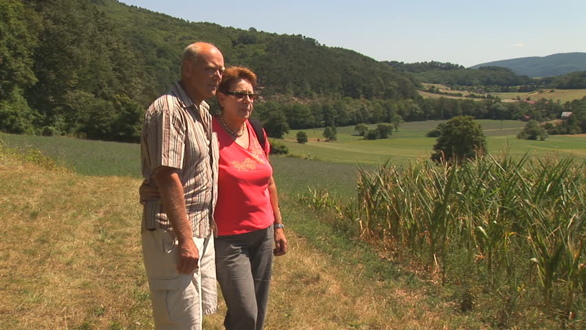 retired couple enjoying their life on a hike