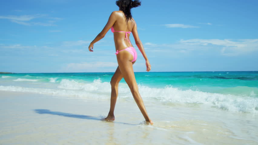Girl in bikini walking