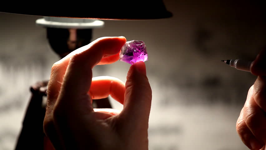 Hand take gem and mark cut 