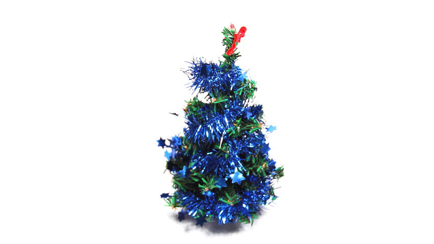 real 3D rotating mini christmas tree isolated on white