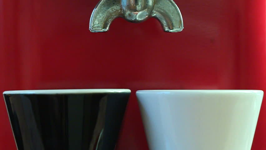 Pouring two Fresh Cups of Brewed Coffee