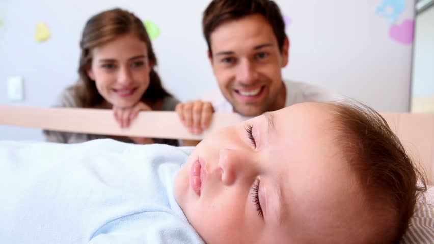 Happy Parents Watching Over Baby Son Stock Footage Video 100 Royalty