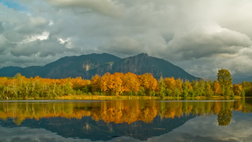HD time lapse of clouds, mountains, autumn trees, and a reflection pond.  Several static treatments of footage.