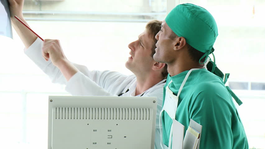 Footage in high definition of medical team examining an x-ray 
