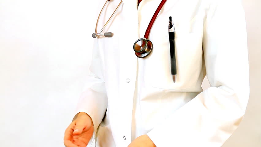 Close up of doctor hands recording something on notepad and gives the  thumb's up sign