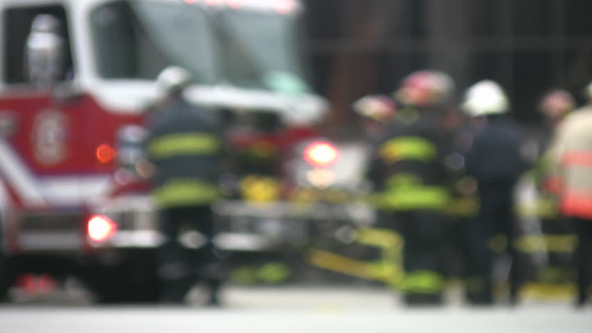 Emergency. Firetruck and firemen at the site of an accident.  