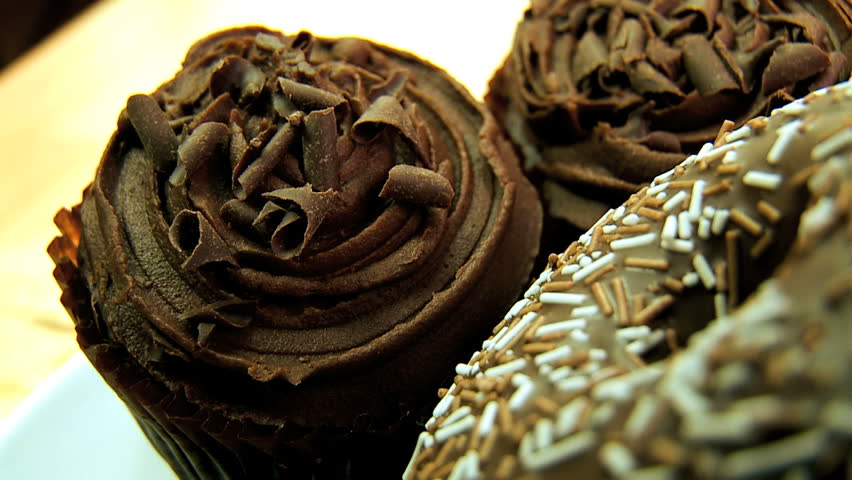 Unhealthy selection of indulgent high calorie sweet & sticky cakes & cookies