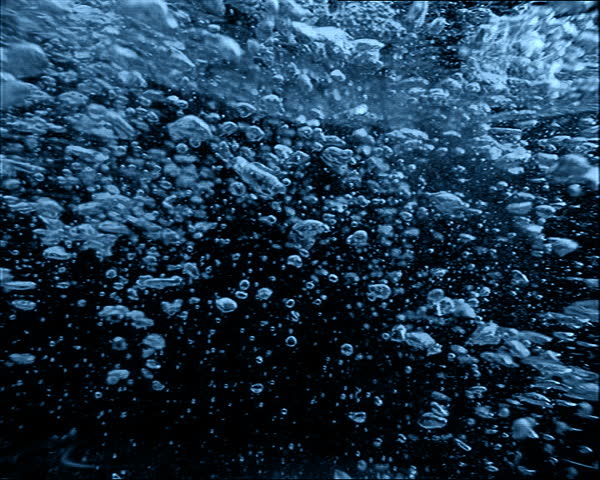 dynamic dancing bubbles going up to the water surface