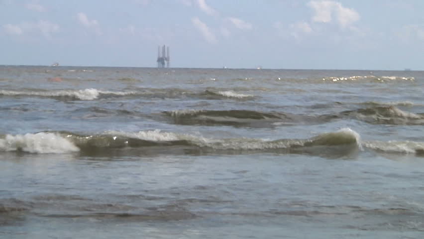 Oil on beach at the beach of Grand Isle, LA  because of oil pollution from the Deepwater Horizon Disaster
