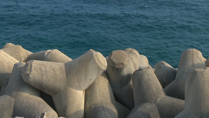 Concrete breakwater in seashore