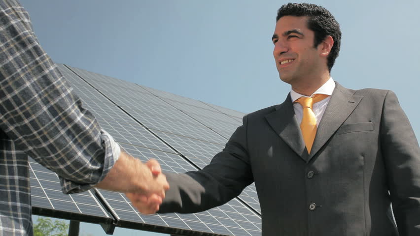 Handshake between electrician and engineer in solar power station (series)