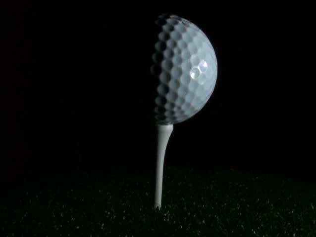 Golf ball on tee in grass - NTSC