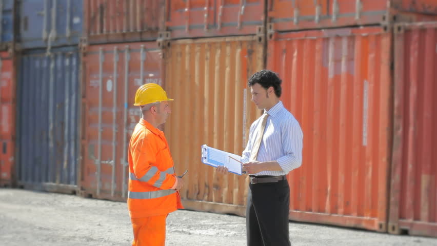 Worker, manager and cargo containers in logistics area (series)