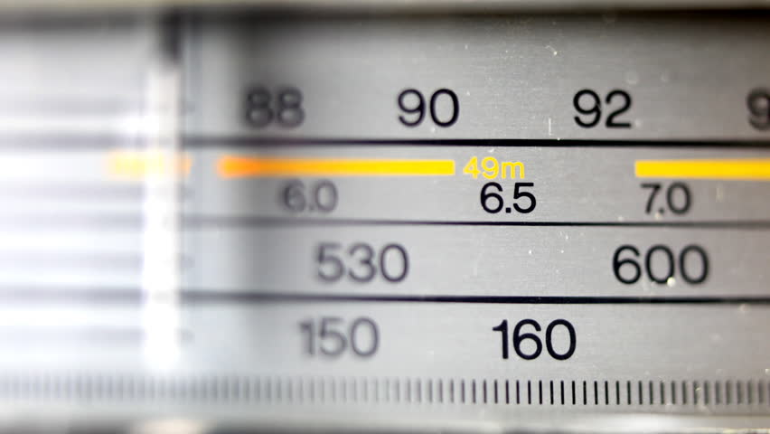 an analogue radio dial tuning in different radio frequencies