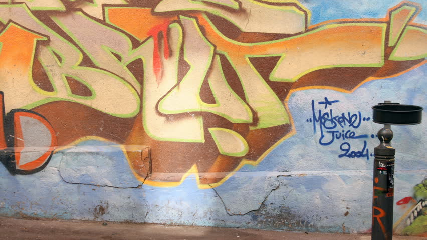 man walks and leans against wall