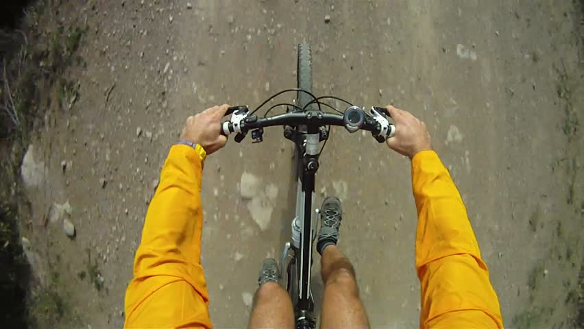 Mountain Bike being ridden along dirt track