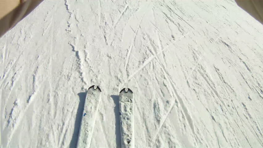 Skis traveling down a ski slope