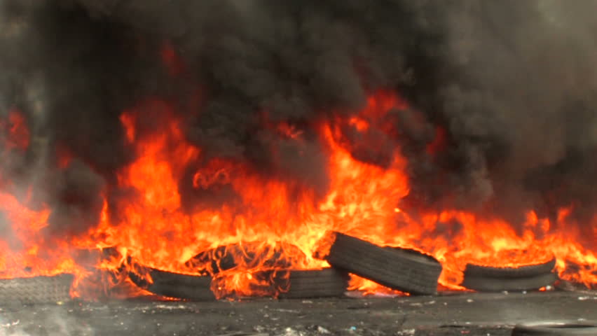 A barricade of tires burn during a riot, Bangkok, Thailand - 2010