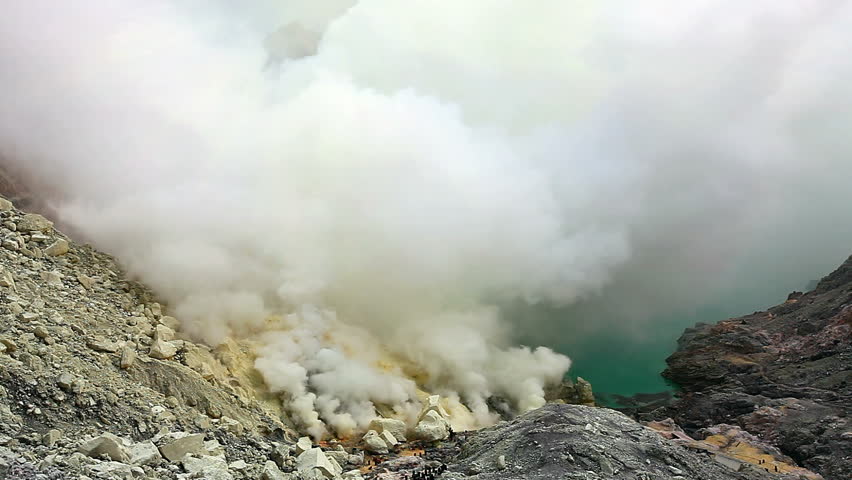 Panoramic view from the top of Ijen crater on sulfur mine and acid crater lake. East Java, Indonesia.