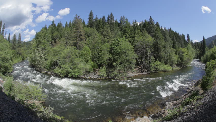 Static clip of a large bend in the Sacramento River (not far from its headwater); includes ambient audio; fisheye lens.