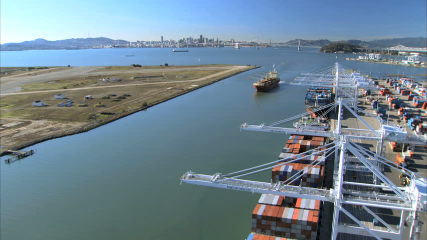 Low aerial view of a container port on San Francisco coastline