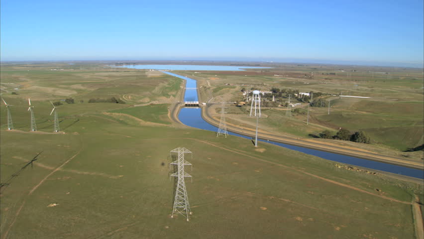 Aerial view over manmade irrigation chanel & hydro-electric dam