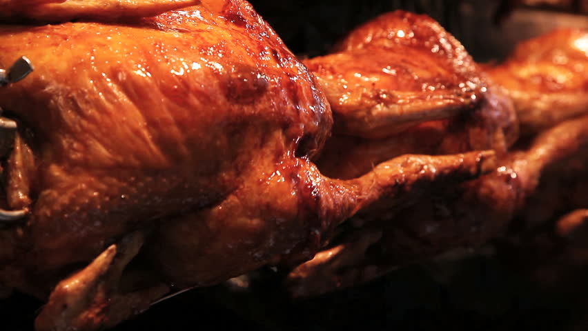 Chicken rotating on a skewer. 