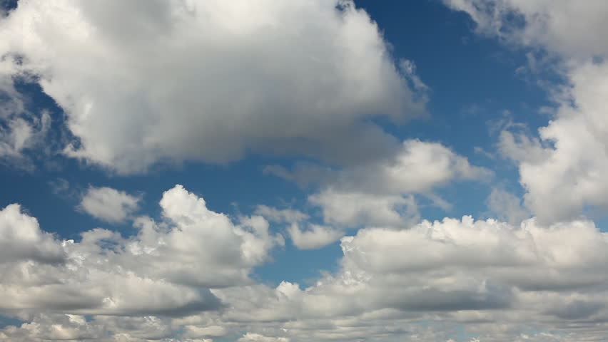 White clouds running over blue sky