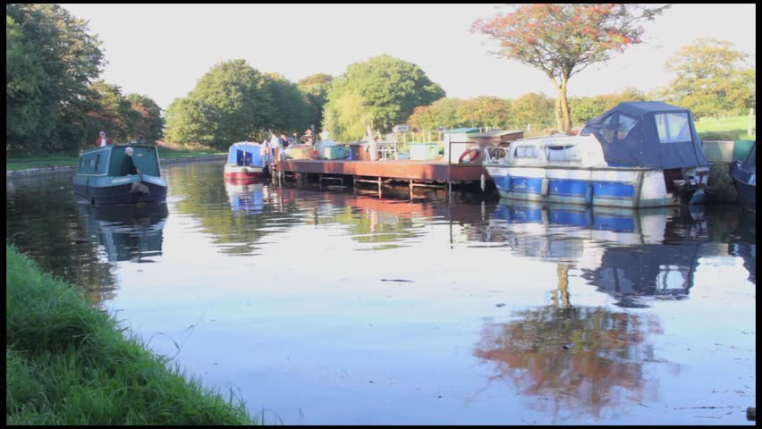 A narrow-boat sails passed the camera