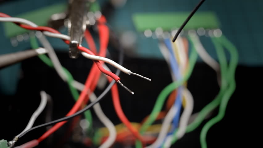 macro of soldering a white cable