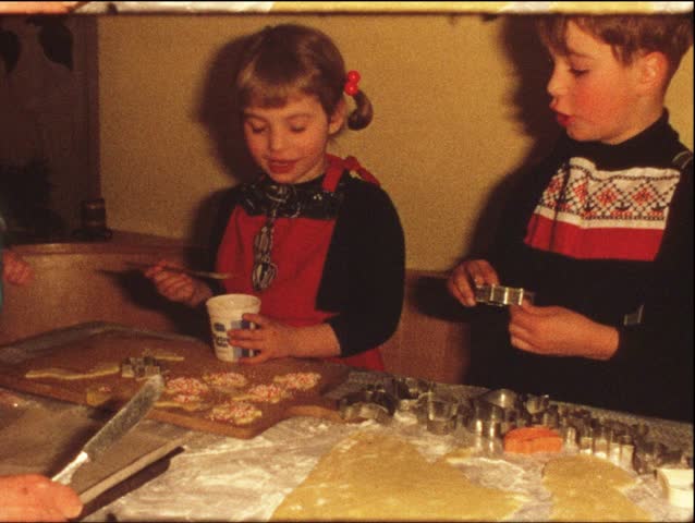 Children making Cristmas cookies (vintage 8 mm amateur film)