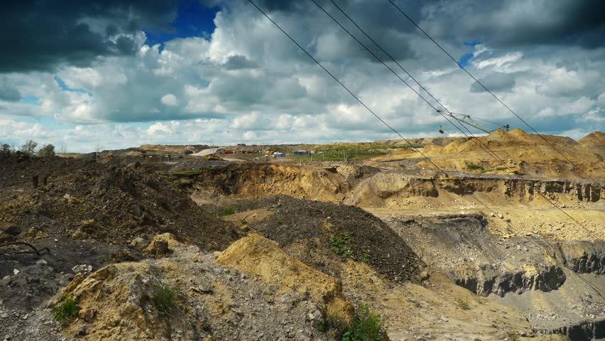 Coal production. Panning timelapse of opet pit mine